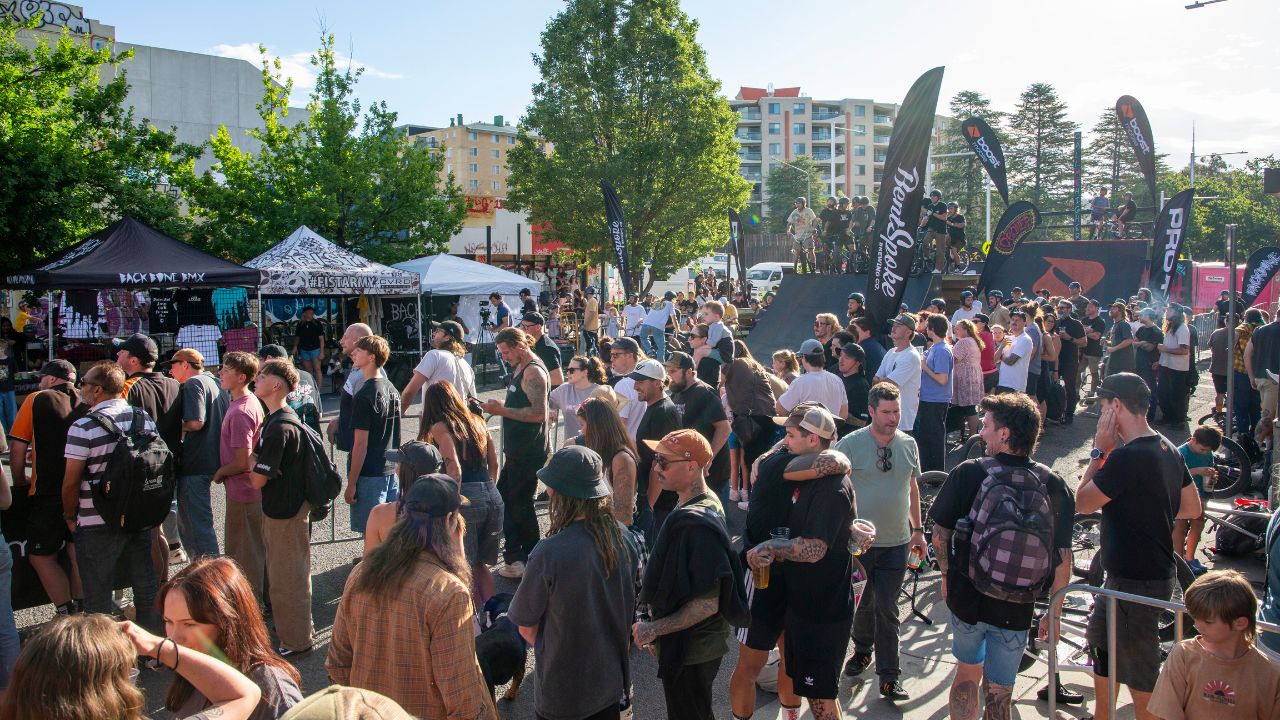 Crowds on Elouera Street with BMX ramps. 