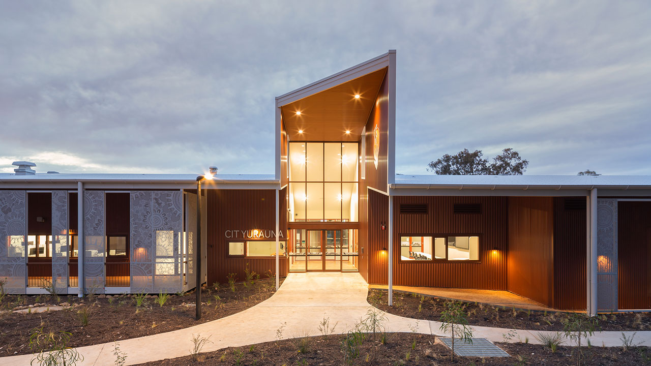 A newly built building photographed at dusk.