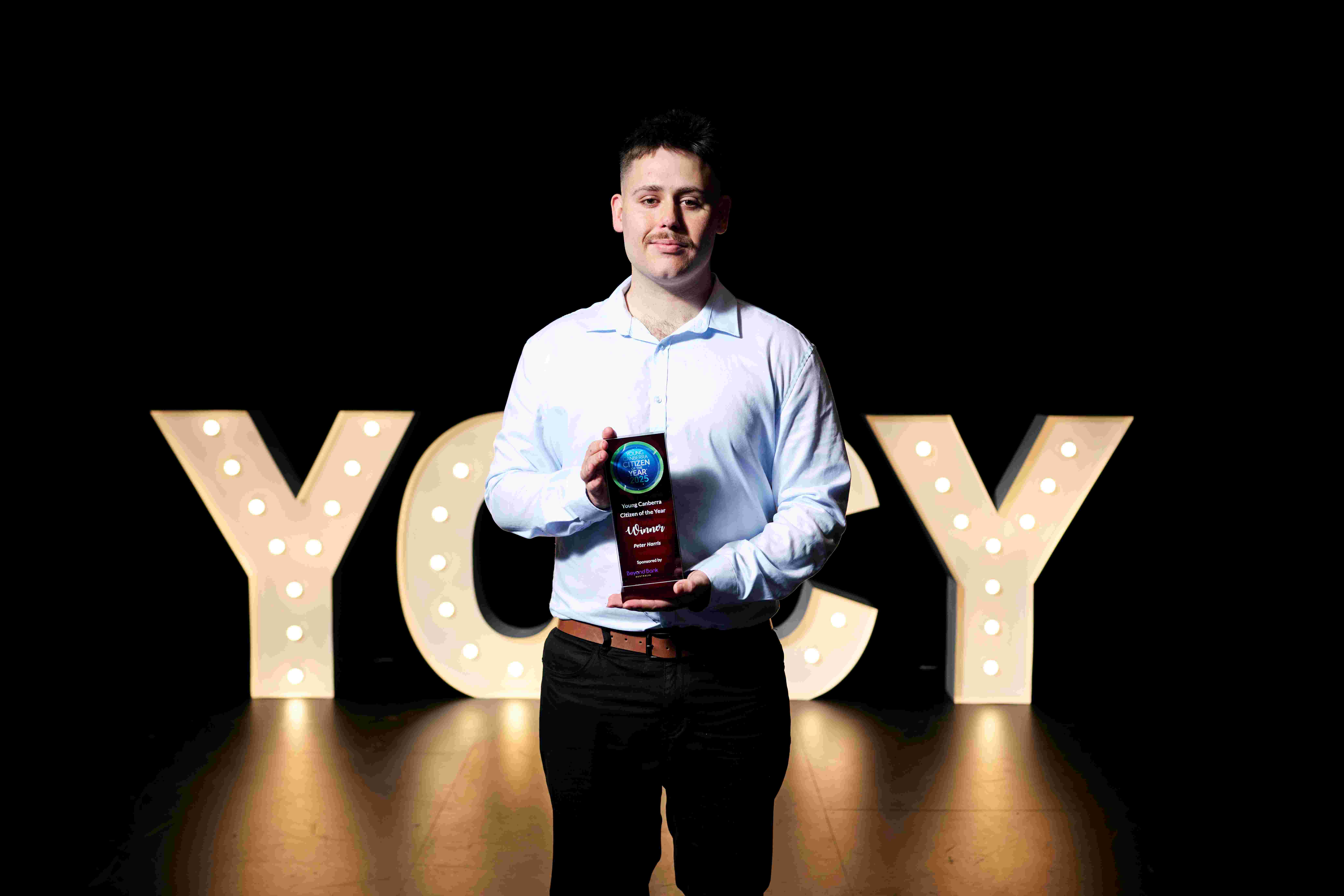 Peter Harris with his award