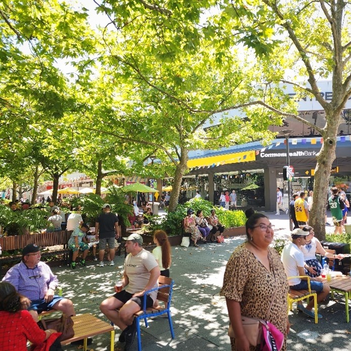 People making the most of the shade and seating in City Walk