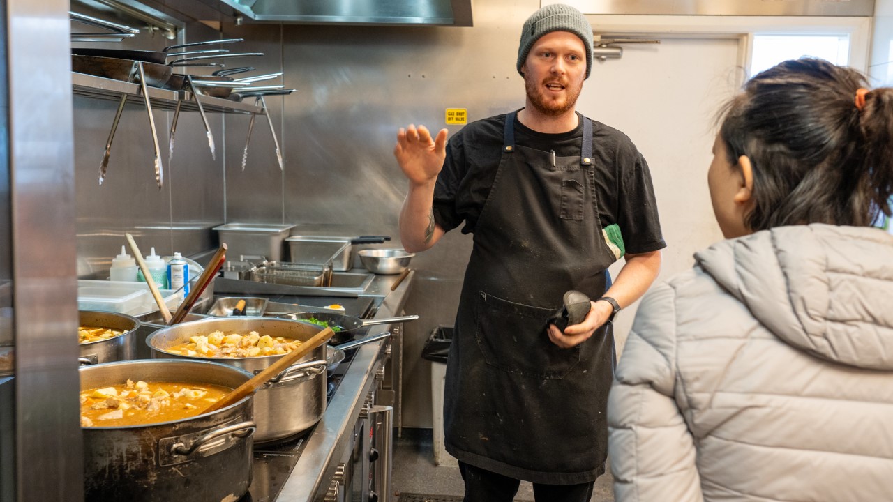 Gang-Gang Cafe Chef Chris Lenard explaining induction benefits to ACT Public Servant