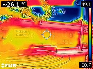 A thermal image showing the sources of radiant heat near Dickson library, with the most heat reflected off the buildings awnings.