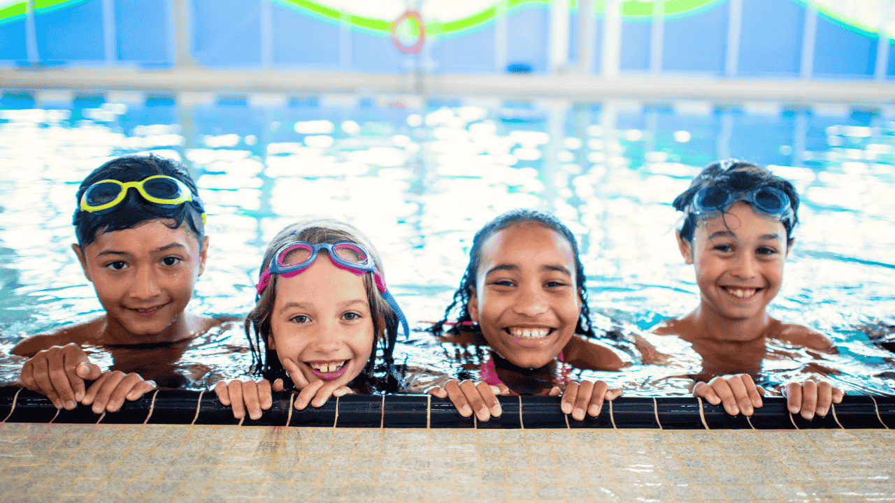 Four children in a pool.
