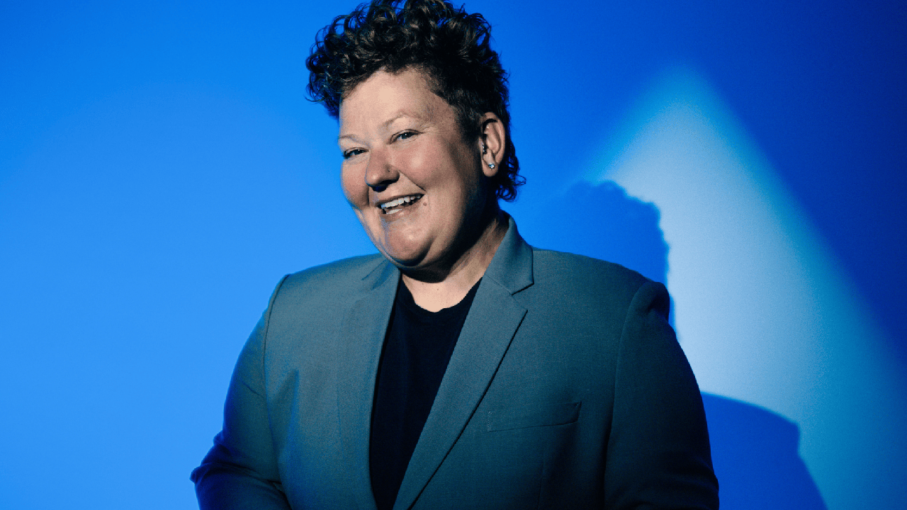 A woman with short hair, smiling