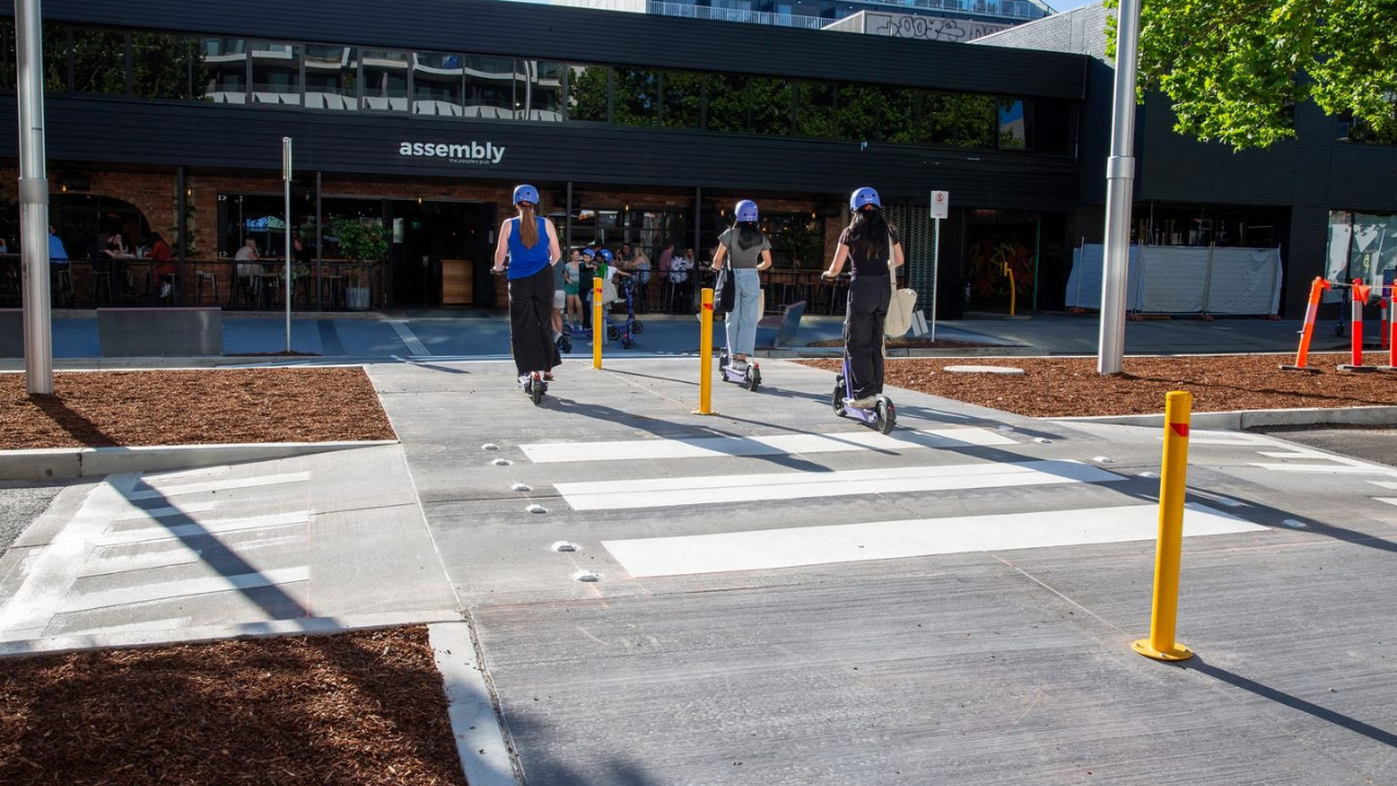 E-scooter riders using the new pedestrian crossing installed on Lonsdale Street