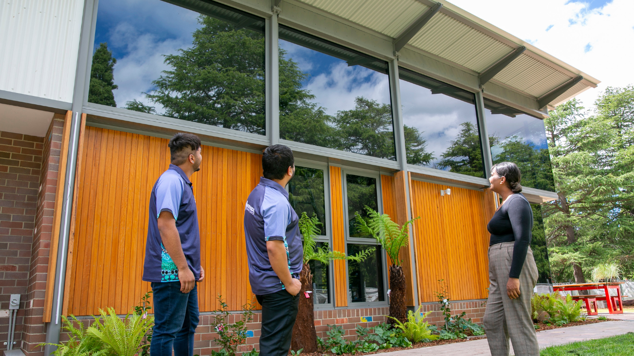 Staff members from Northside Community Service examine the new community centre in Haig Park