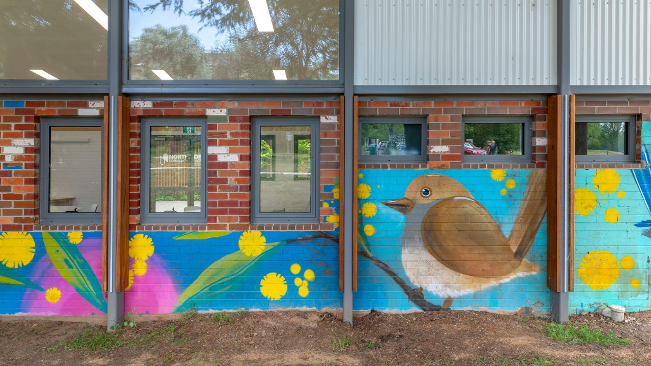 Painted bricks and a mural on the 1950s mowing depot wall repurposed for the new Salthouse Community Centre