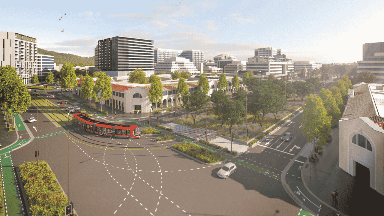 Artist’s impression of Canberra city centre with a red light rail vehicle travelling through a large intersection. Tree-lined streets, dedicated cycling lanes, landscaped median strips, and a central green public space are surrounded by mid-rise buildings.